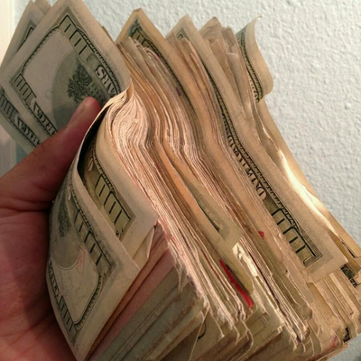 stacks of money in hand